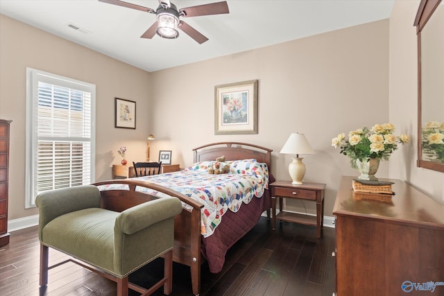 bedroom featuring ceiling fan and dark hardwood / wood-style floors