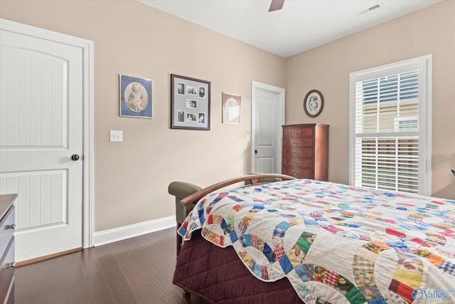 bedroom featuring ceiling fan and dark wood-type flooring