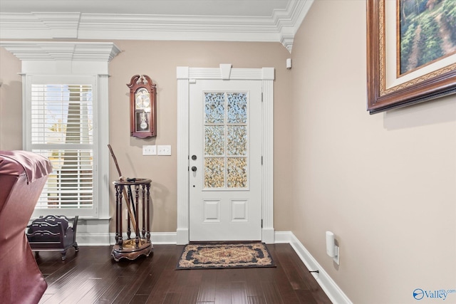 entrance foyer with hardwood / wood-style floors and crown molding