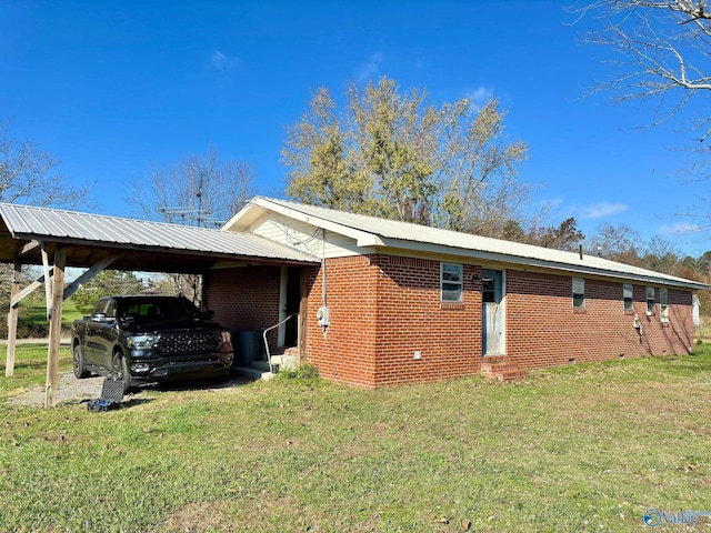 view of property exterior with a carport and a yard