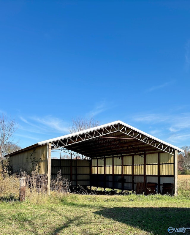 rear view of house featuring a yard