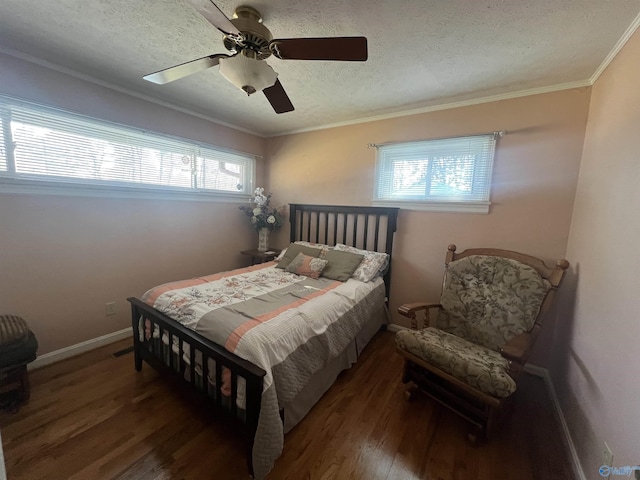 bedroom with a ceiling fan, wood finished floors, baseboards, ornamental molding, and a textured ceiling