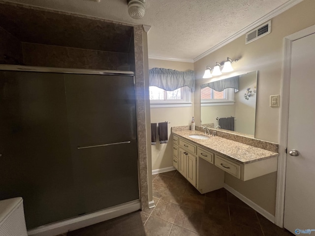 full bathroom featuring an enclosed shower, ornamental molding, visible vents, and a textured ceiling