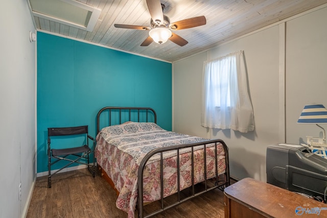 bedroom featuring crown molding, dark hardwood / wood-style floors, wood ceiling, and ceiling fan