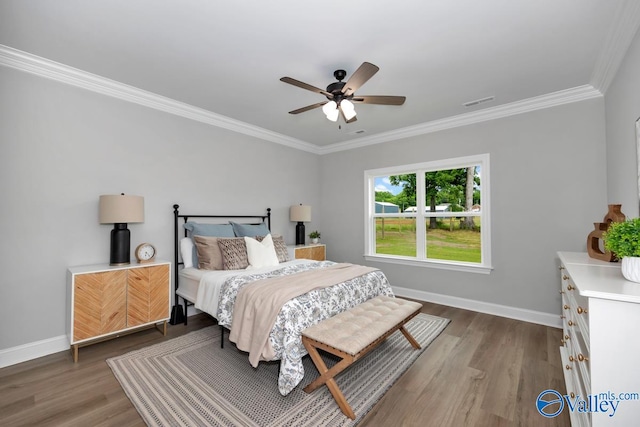 bedroom with ornamental molding, ceiling fan, and dark hardwood / wood-style floors