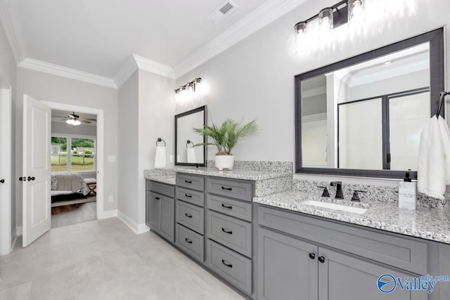 bathroom with ceiling fan, vanity, and ornamental molding