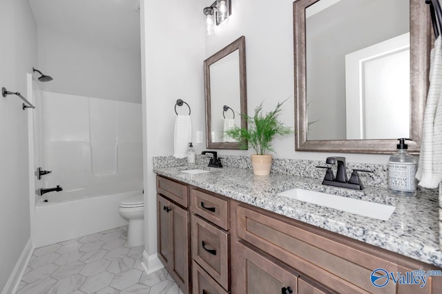 full bathroom featuring toilet, vanity, and bathing tub / shower combination