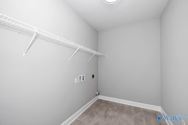 washroom featuring hookup for an electric dryer, hookup for a washing machine, and hardwood / wood-style flooring