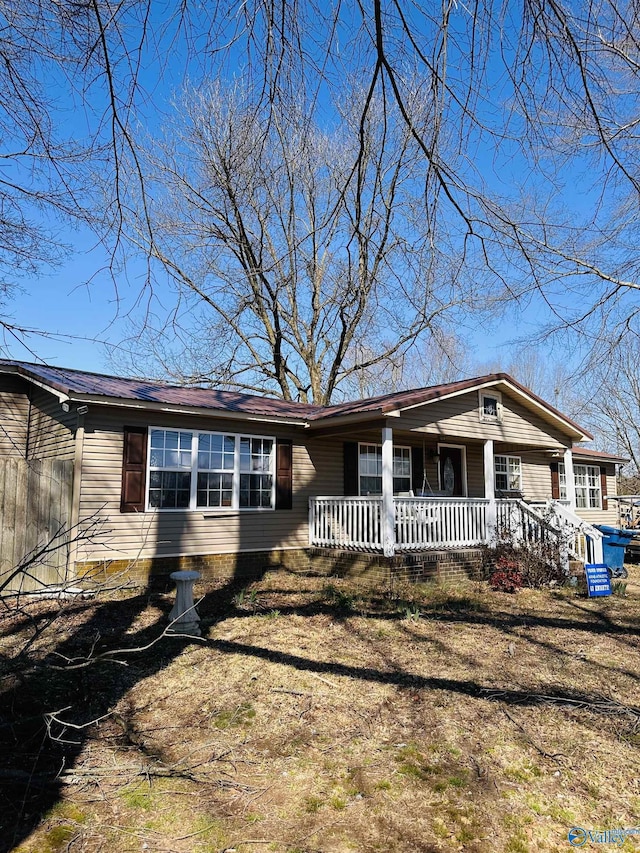 view of front of home featuring crawl space and a porch