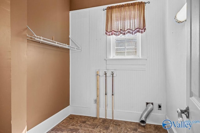 clothes washing area with hookup for an electric dryer, hookup for a washing machine, and laundry area