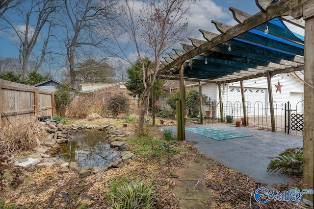 view of yard with a pergola and fence