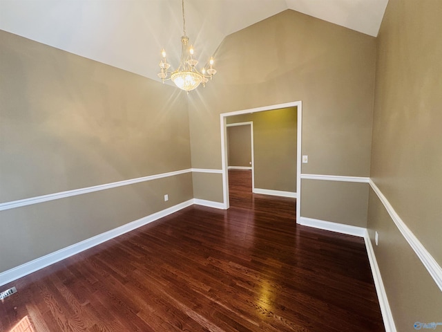 unfurnished room featuring lofted ceiling, baseboards, visible vents, a chandelier, and wood finished floors