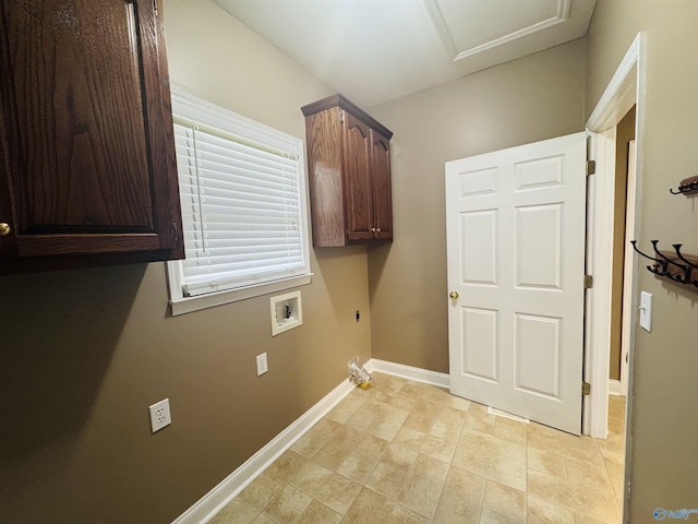 laundry room featuring electric dryer hookup, cabinet space, hookup for a washing machine, plenty of natural light, and baseboards