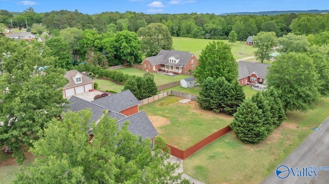 drone / aerial view featuring a view of trees