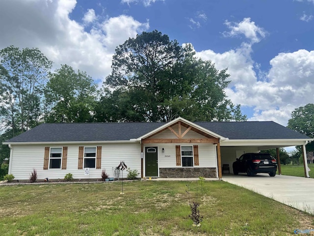 1006 SW 6th St, Attalla, AL 35954 - ranch-style house featuring a front yard, driveway, and a carport