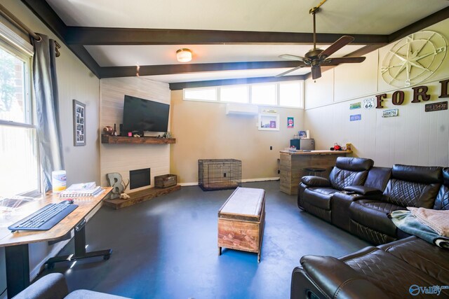 living room with concrete floors, a large fireplace, ceiling fan, and vaulted ceiling with beams