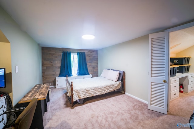 bedroom featuring light colored carpet