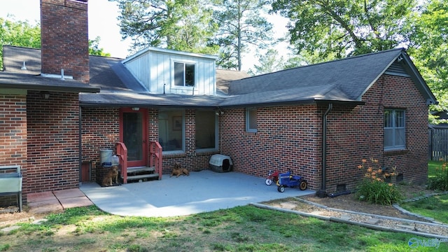 back of house with a patio