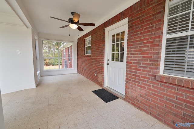 exterior space with ceiling fan