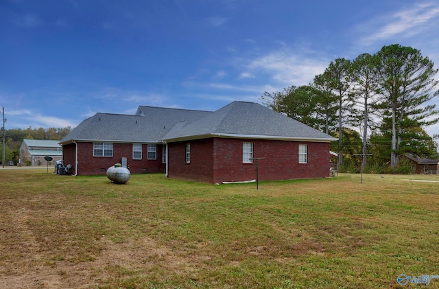 rear view of house with a lawn