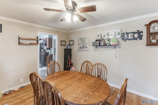 dining room featuring crown molding, ceiling fan, and light hardwood / wood-style floors