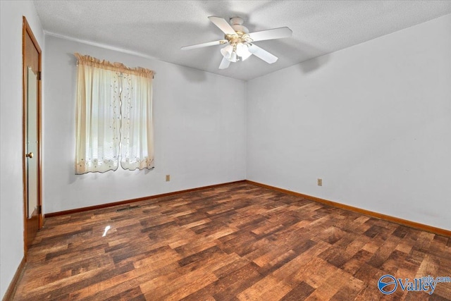 unfurnished room featuring a textured ceiling, ceiling fan, wood finished floors, and baseboards