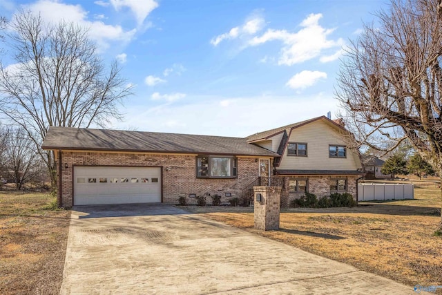 view of front facade with a garage and a front yard