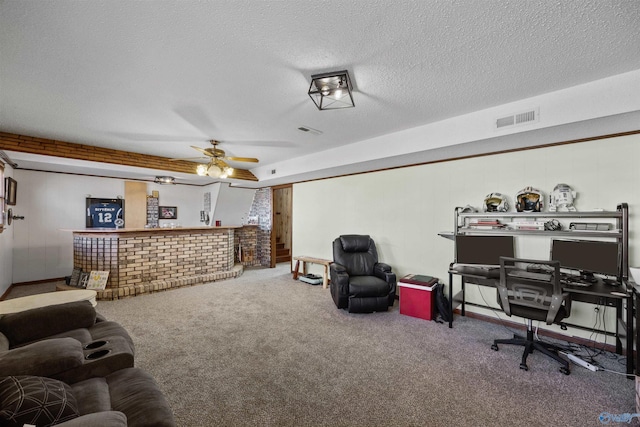 interior space with indoor bar, ceiling fan, a textured ceiling, and carpet flooring