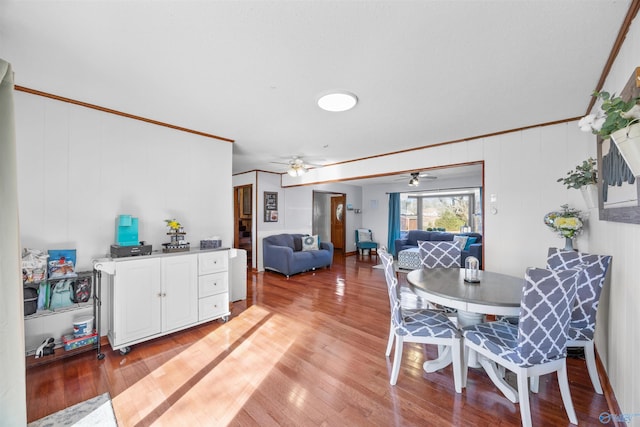 dining area with crown molding, ceiling fan, and hardwood / wood-style floors