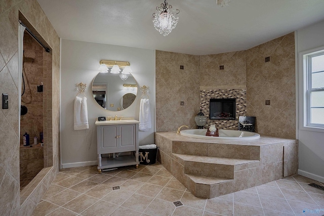 208 Burgess Ave, Rainsville, AL 35986 - full bath with a garden tub, vanity, tile patterned flooring, and baseboards