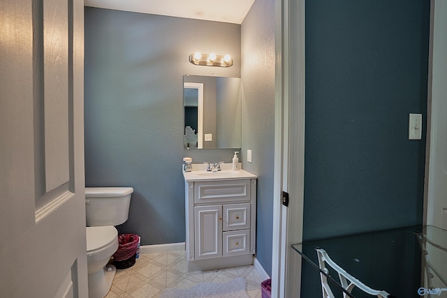 208 Burgess Ave, Rainsville, AL 35986 - half bathroom with toilet, vanity, baseboards, and tile patterned flooring