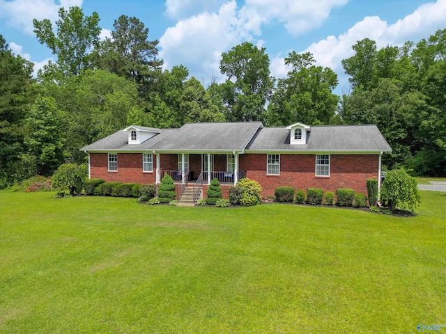 208 Burgess Ave, Rainsville, AL 35986 - view of front facade with brick siding, a porch, and a front yard