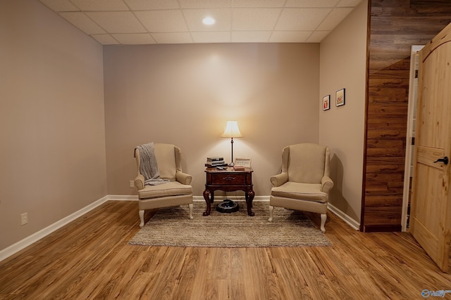 208 Burgess Ave, Rainsville, AL 35986 - living area with light wood finished floors, a paneled ceiling, and baseboards