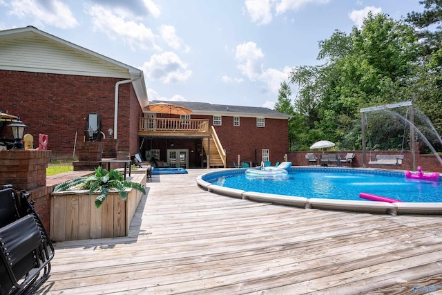 208 Burgess Ave, Rainsville, AL 35986 - outdoor pool featuring a deck, stairway, a hot tub, and a patio area