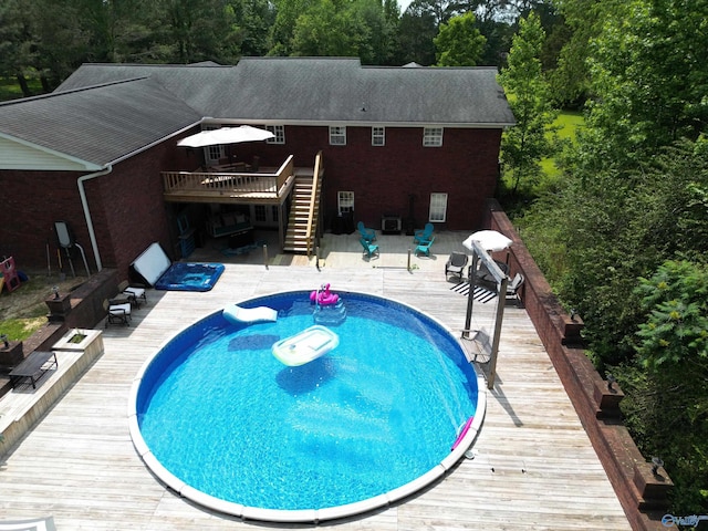 208 Burgess Ave, Rainsville, AL 35986 - outdoor pool featuring a wooden deck and stairway
