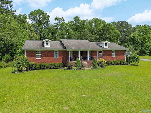 208 Burgess Ave, Rainsville, AL 35986 - view of front of property featuring a porch, a front lawn, and brick siding
