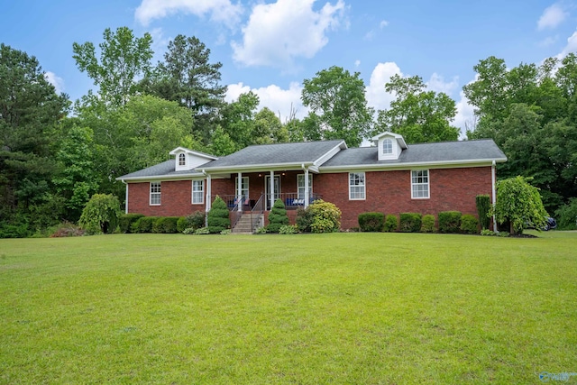 208 Burgess Ave, Rainsville, AL 35986 - view of front of property with a porch, a front yard, and brick siding