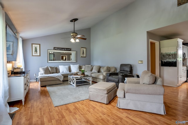 208 Burgess Ave, Rainsville, AL 35986 - living area with lofted ceiling, light wood-style floors, and a ceiling fan