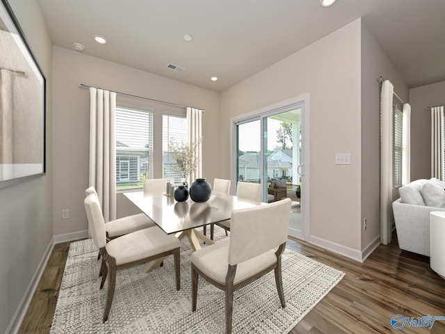 dining space featuring wood finished floors, recessed lighting, and baseboards