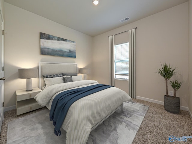 carpeted bedroom featuring baseboards