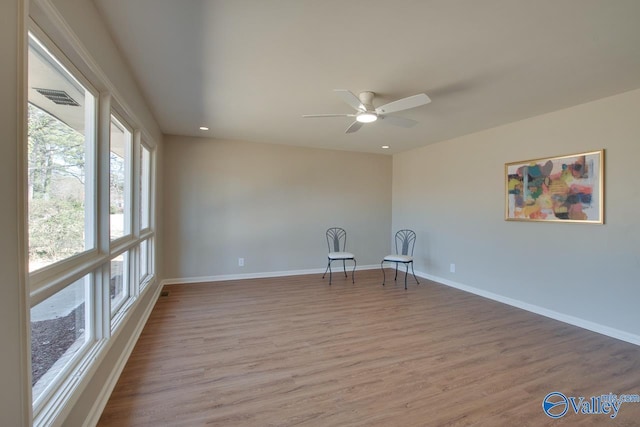 unfurnished room featuring recessed lighting, visible vents, a ceiling fan, light wood-type flooring, and baseboards