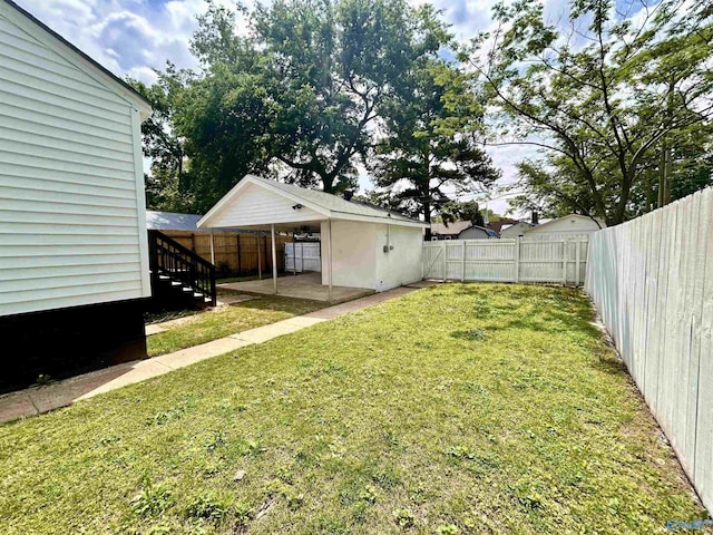 view of yard with a patio and a fenced backyard