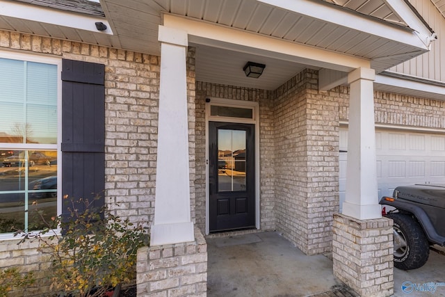 property entrance featuring a porch and a garage