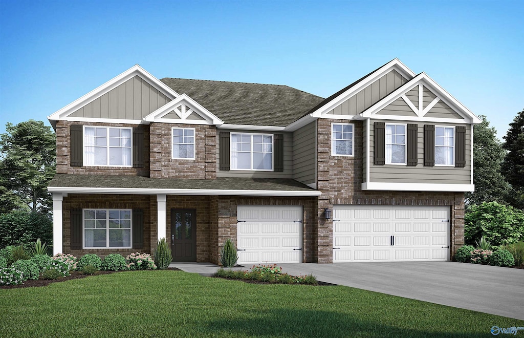 view of front facade with a front yard and a garage