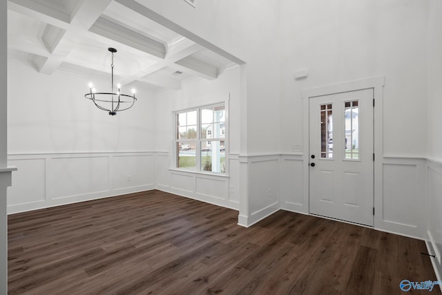 entryway with beam ceiling, dark hardwood / wood-style flooring, a healthy amount of sunlight, and coffered ceiling