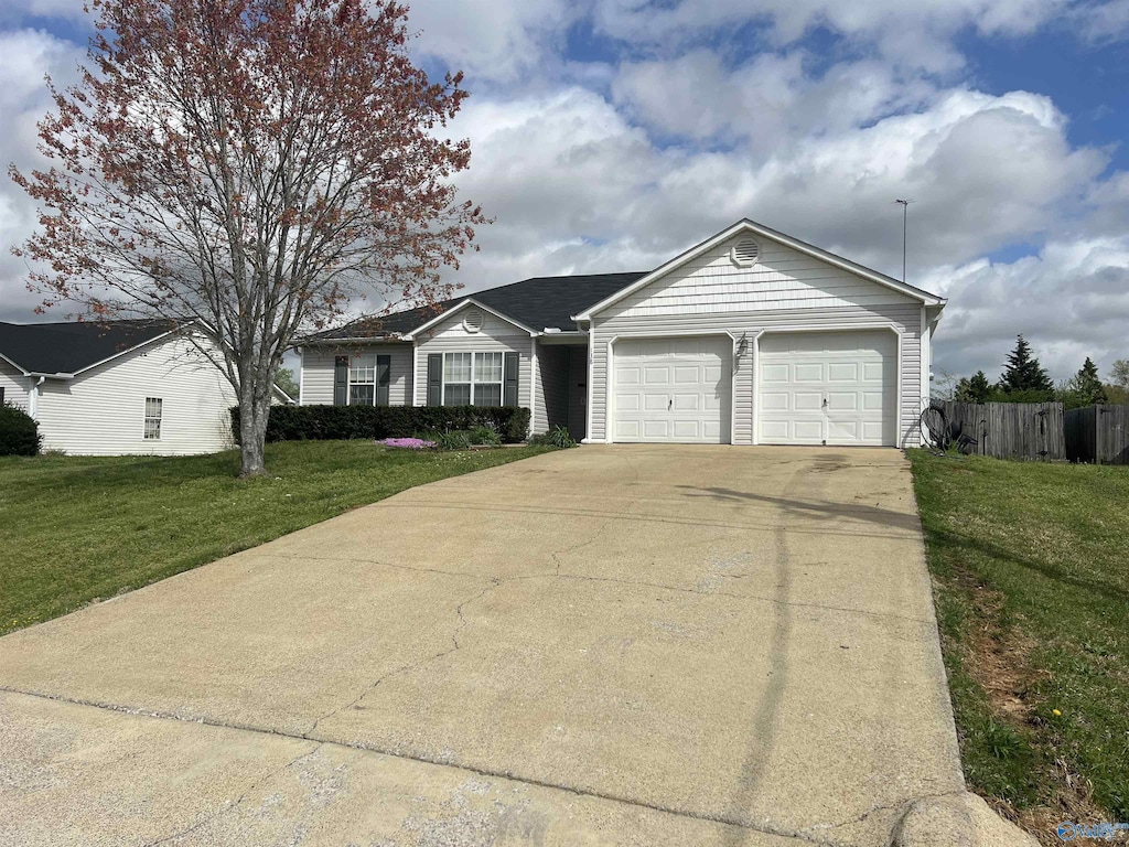 138 Fox Haven Ln, Toney, AL 35773 - single story home featuring a front yard, fence, a garage, and concrete driveway