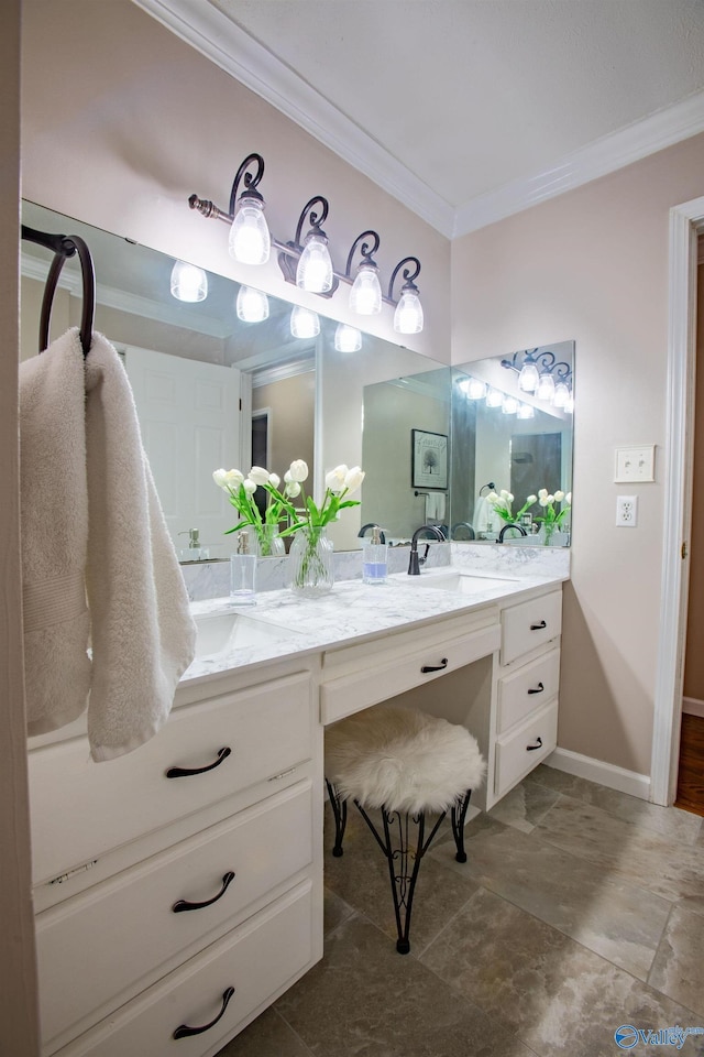 bathroom featuring crown molding and vanity