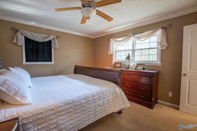 carpeted bedroom featuring ceiling fan, ornamental molding, and a textured ceiling