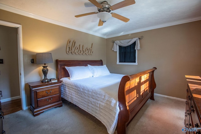 carpeted bedroom featuring ornamental molding and ceiling fan