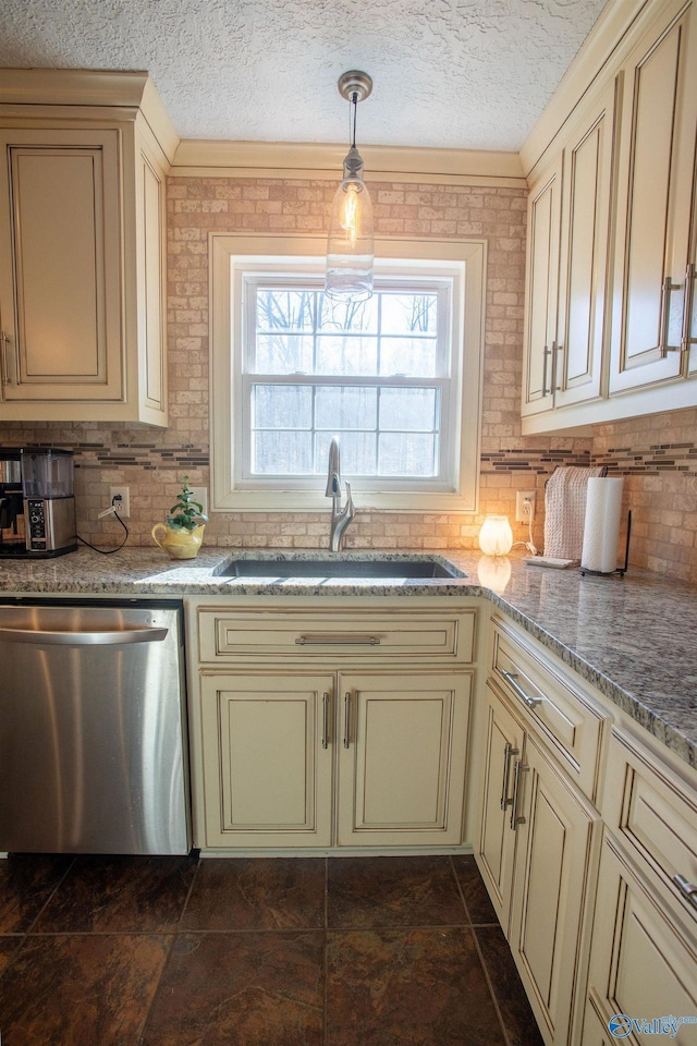 kitchen featuring sink, cream cabinetry, and dishwasher